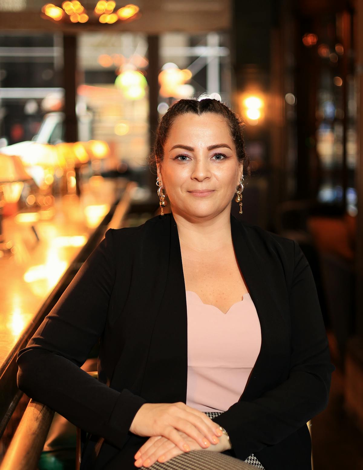 a person sitting at a table in a restaurant