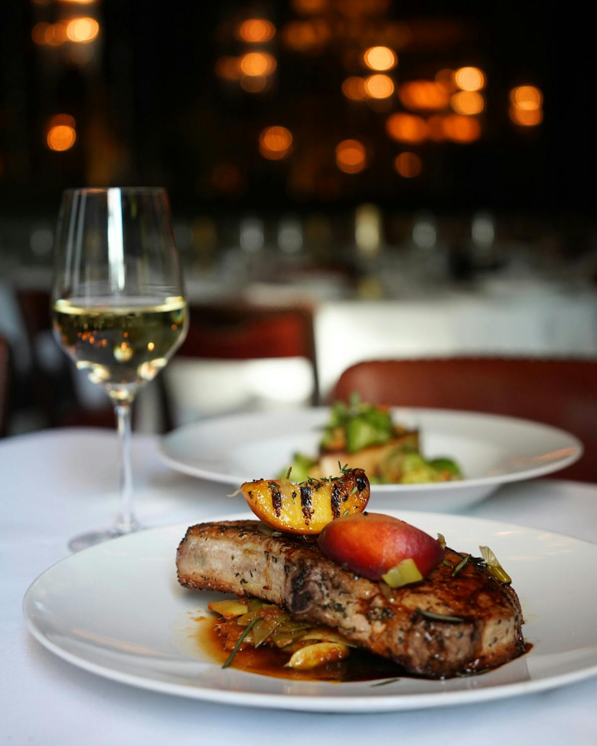a plate of food and a glass of wine