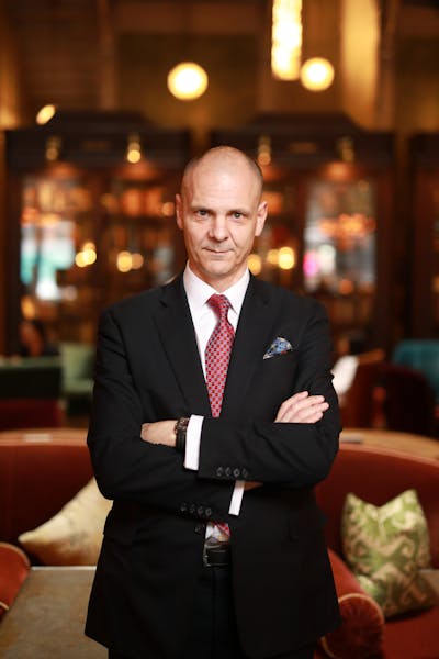 a person wearing a suit and tie