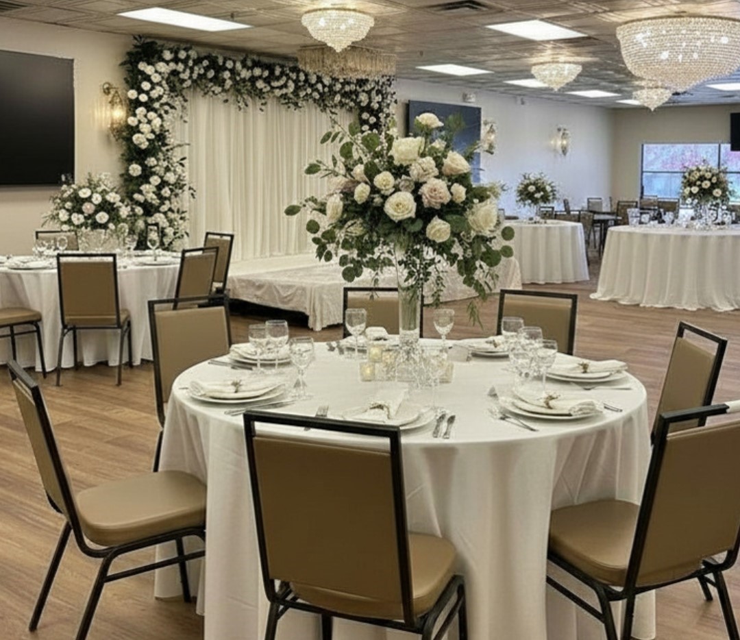 elegant wedding with flower centerpieces and comfortable chairs banquet hall