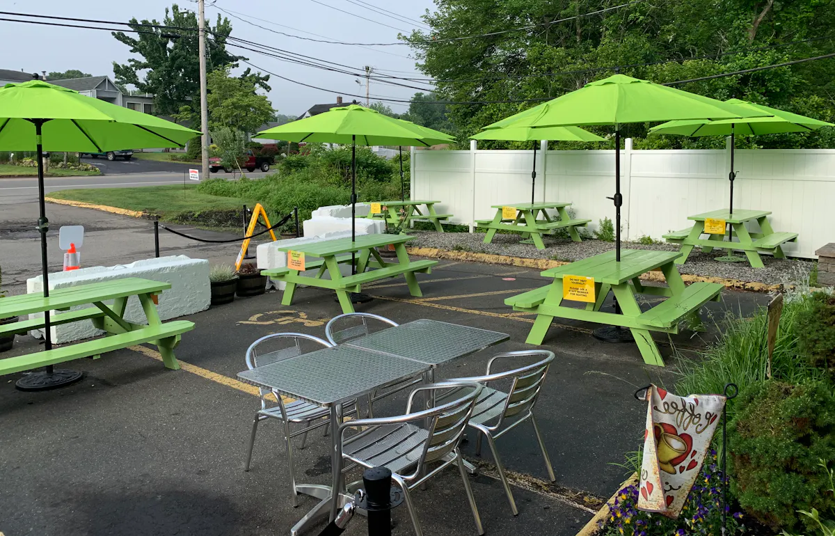 a couple of lawn chairs sitting on top of a table