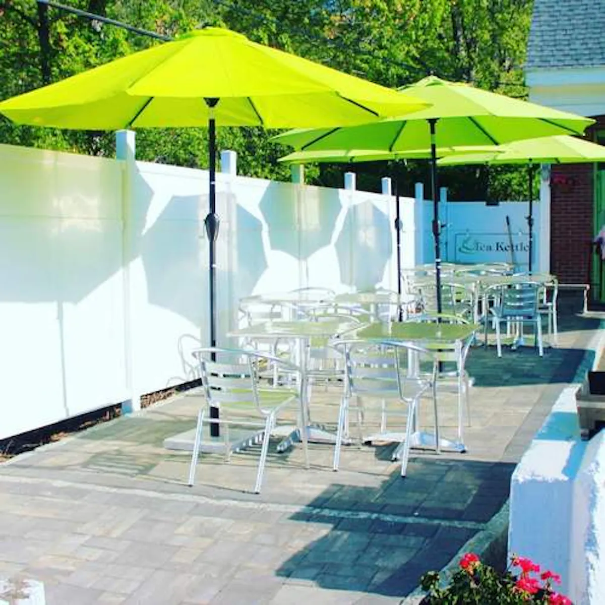 a table topped with a green umbrella