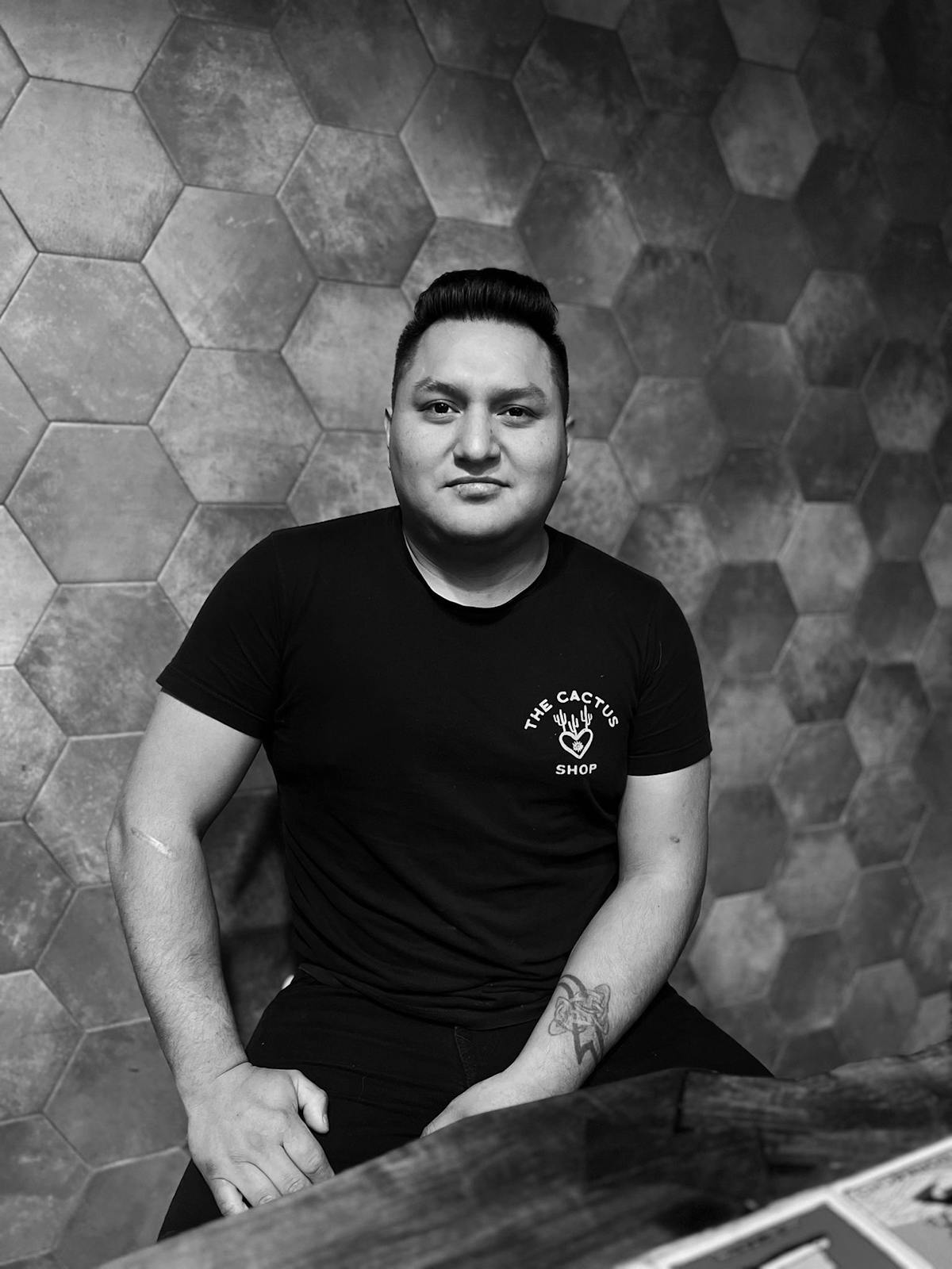 a man standing in front of a wall