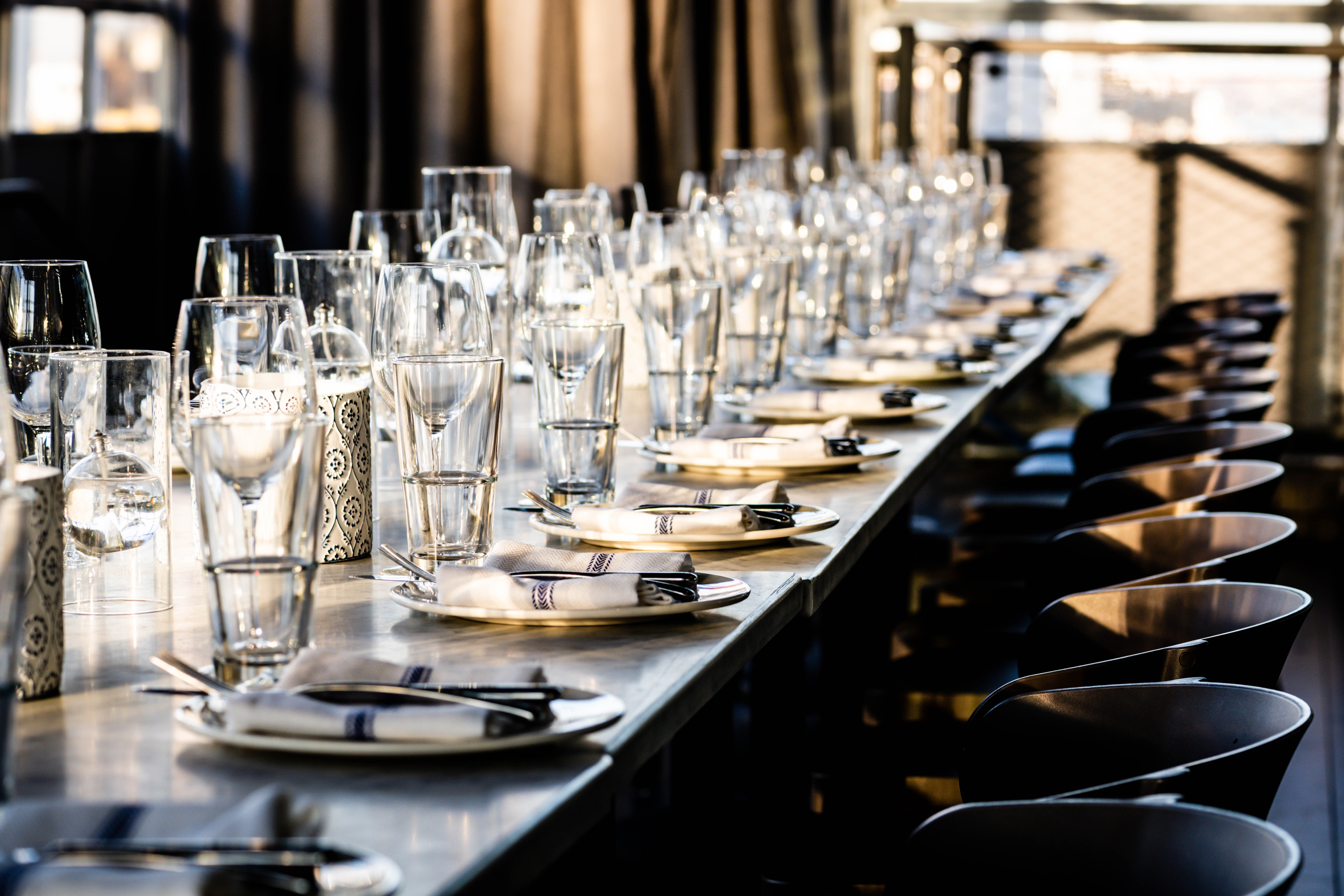 a row of wine glasses on a table