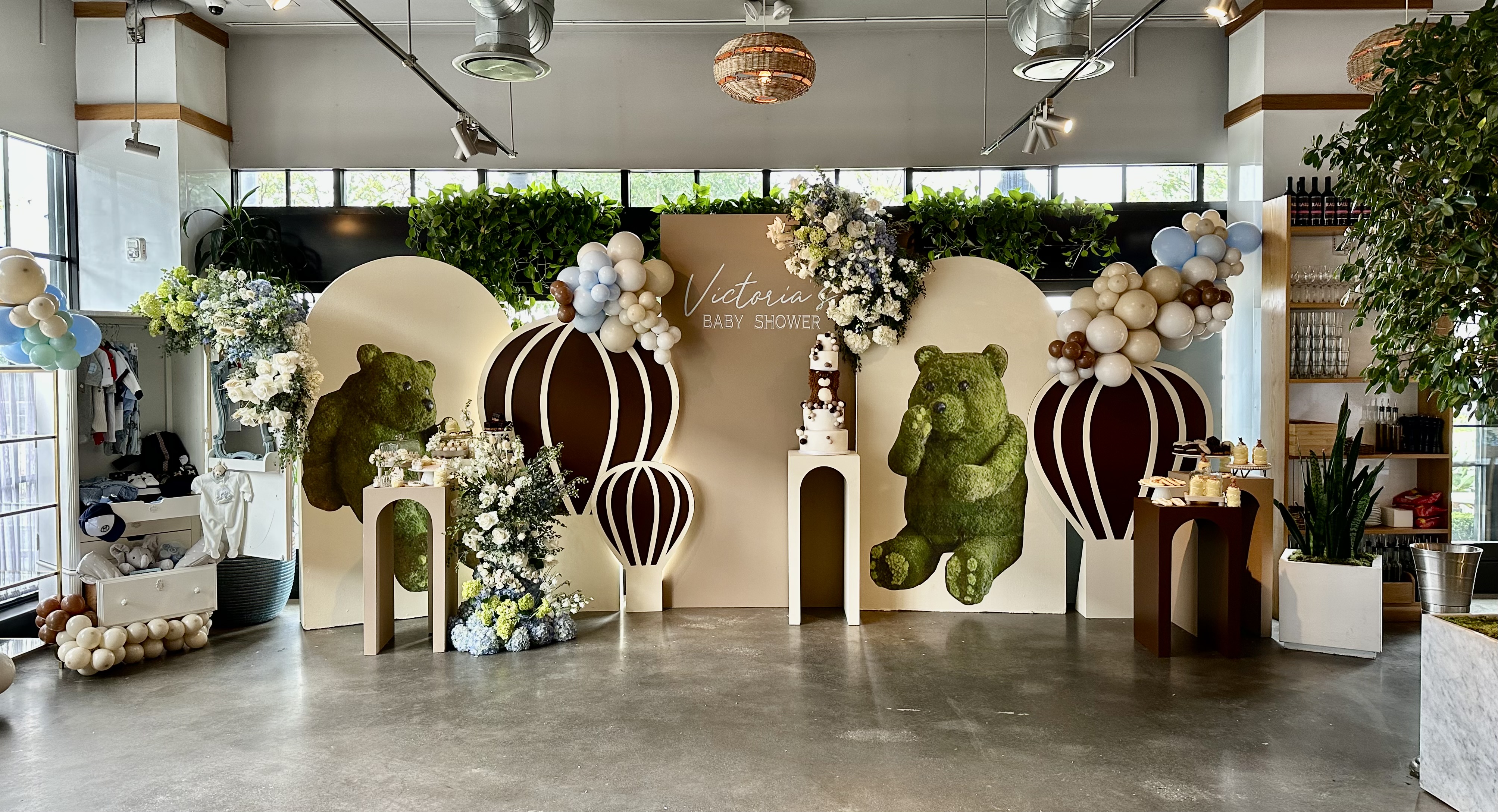 a room filled with furniture and vase of flowers on a table