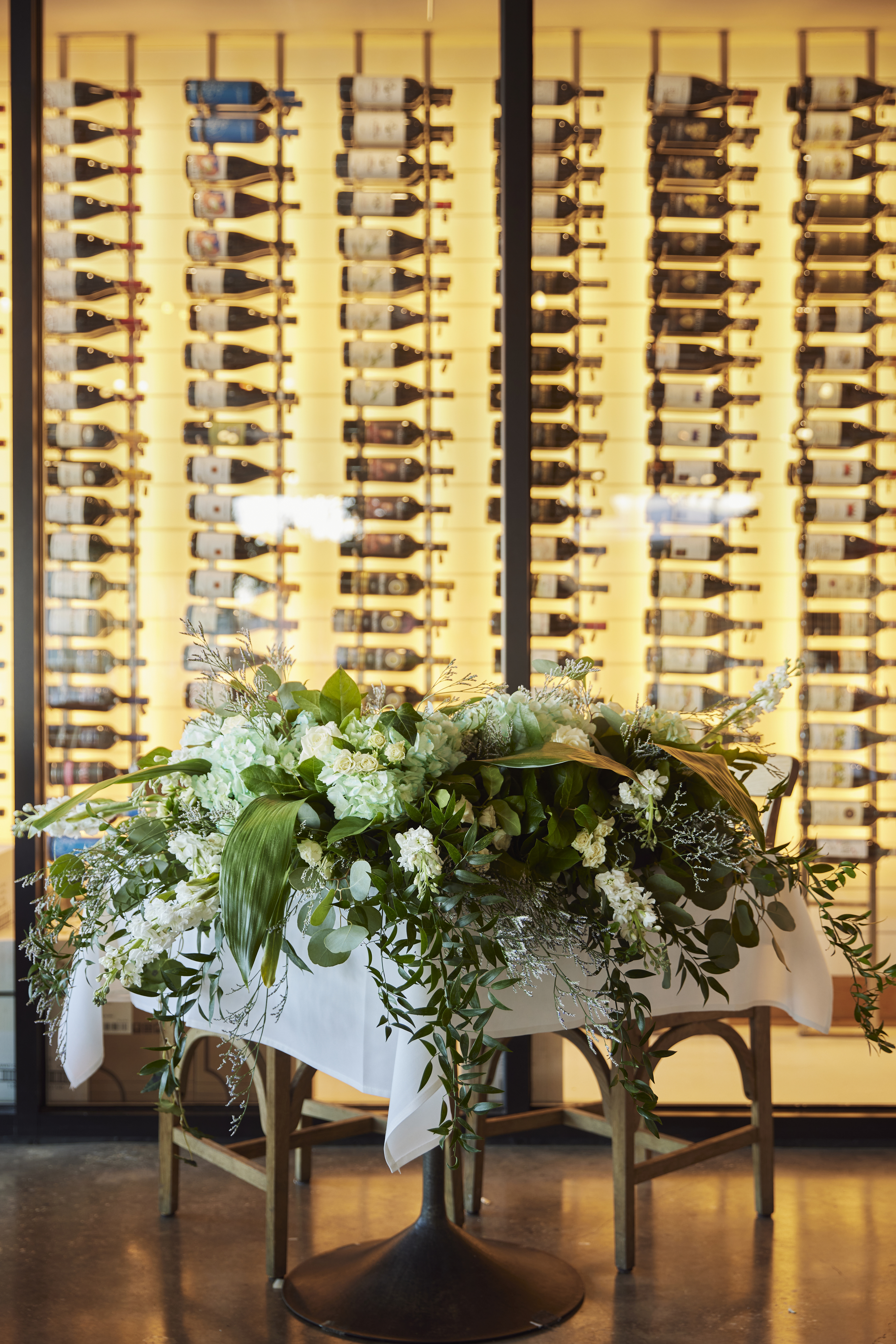 a room filled with furniture and vase of flowers on a table
