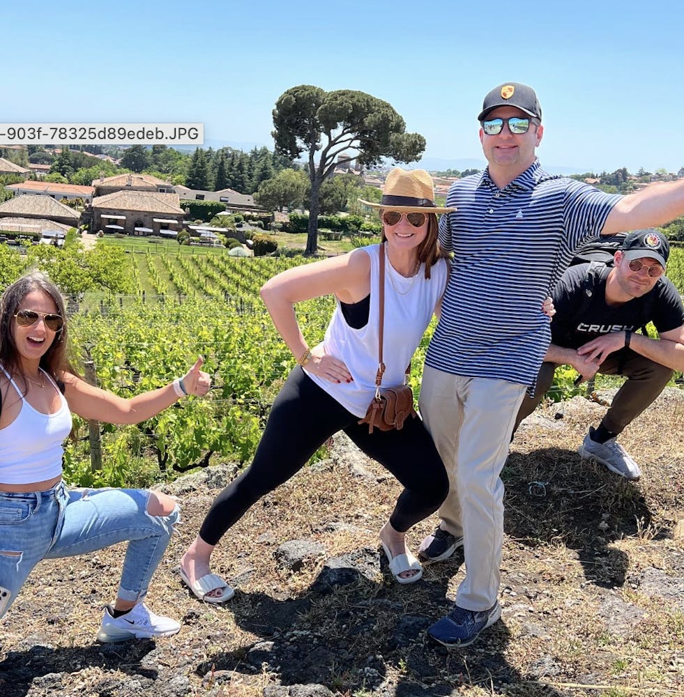 a group of people throwing a frisbee