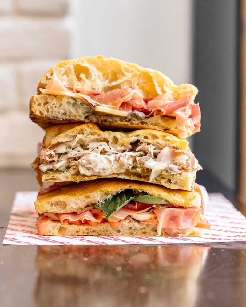 a close up of a sandwich sitting on top of a table