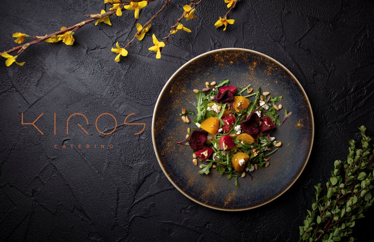 a bowl of food on a plate with the Kiros logo on it.