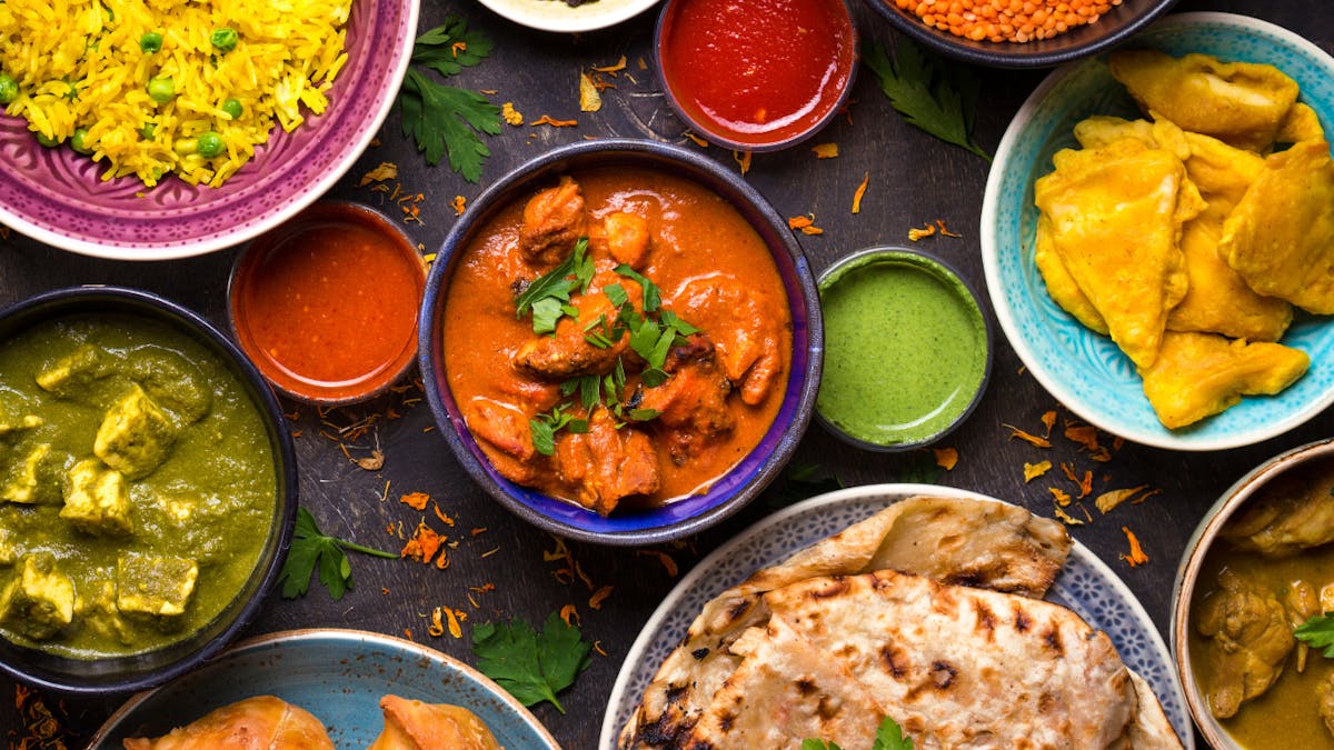 a bowl filled with different types of food on a plate