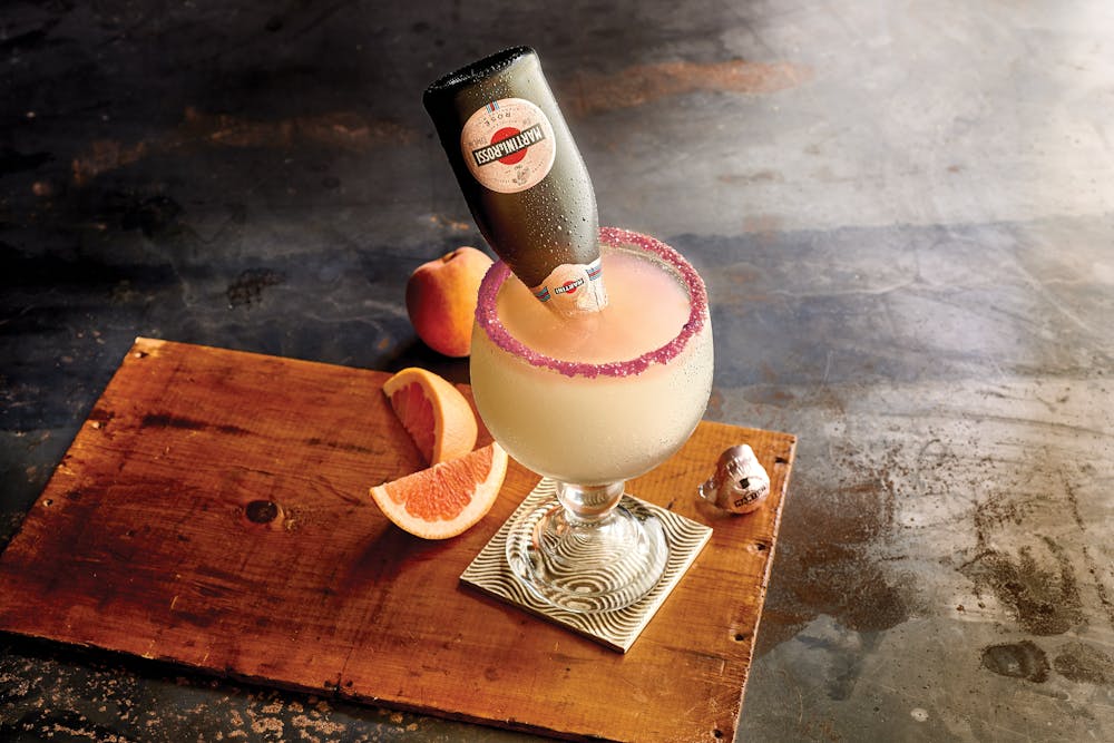 a cup of coffee sitting on top of a wooden table