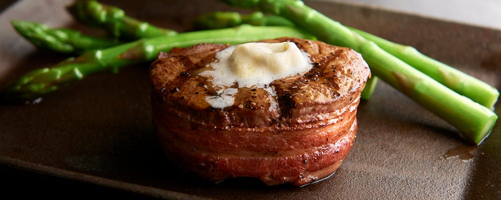 a piece of cake sitting on top of a green plant
