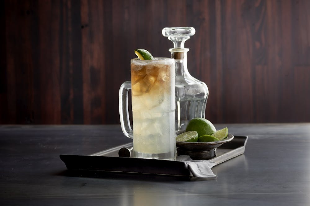 a glass vase sitting on top of a wooden table