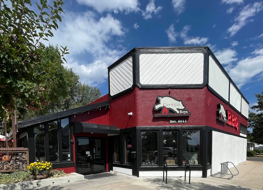 a group of people in front of a building