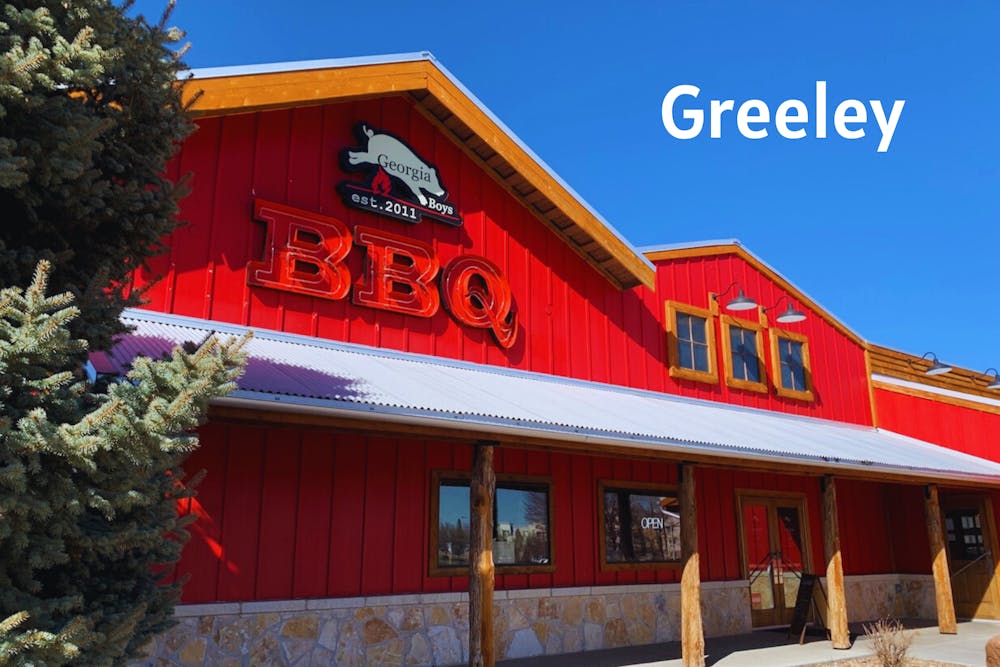 a sign in front of a building