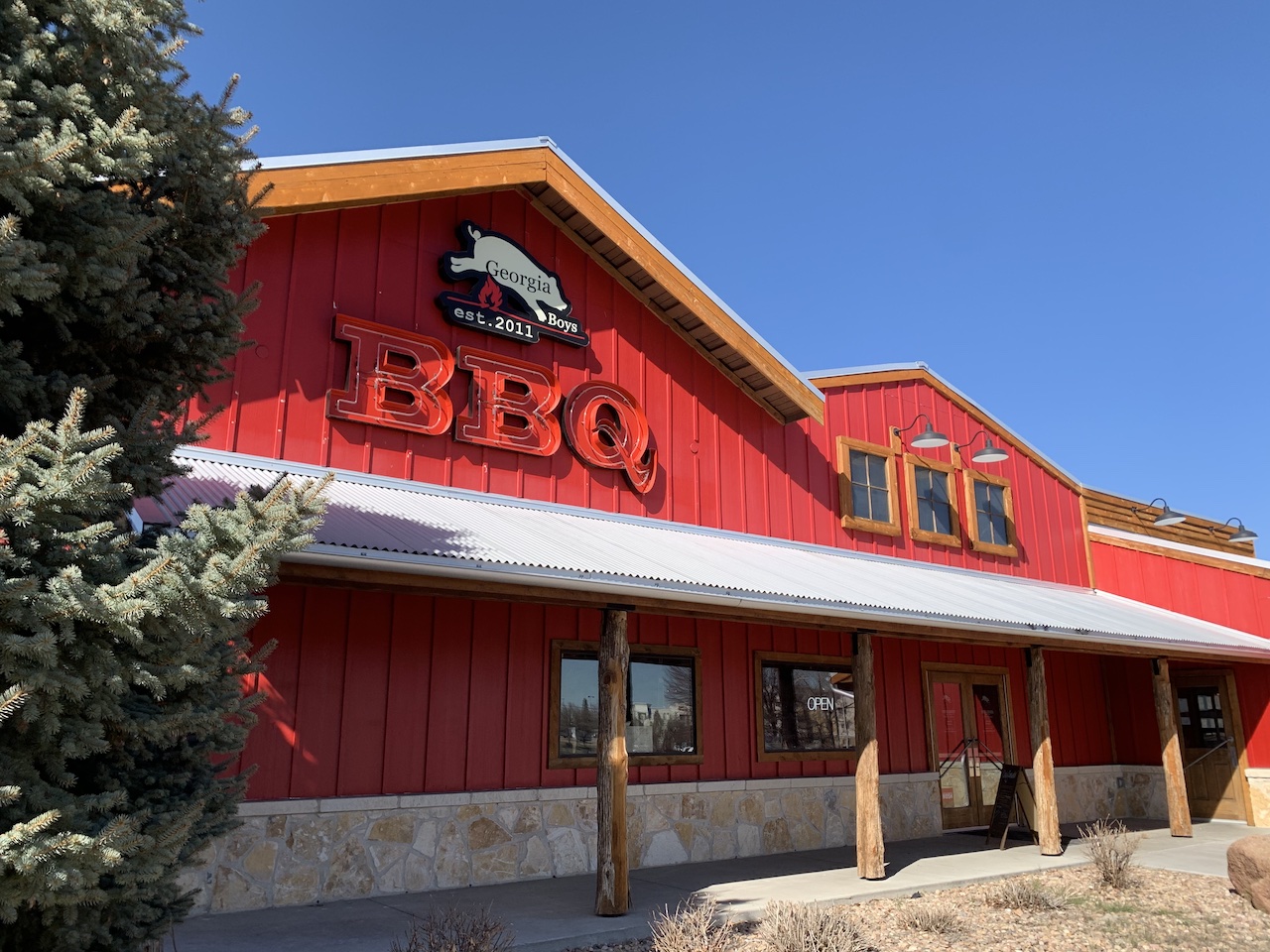 a house that has a sign on the side of a building