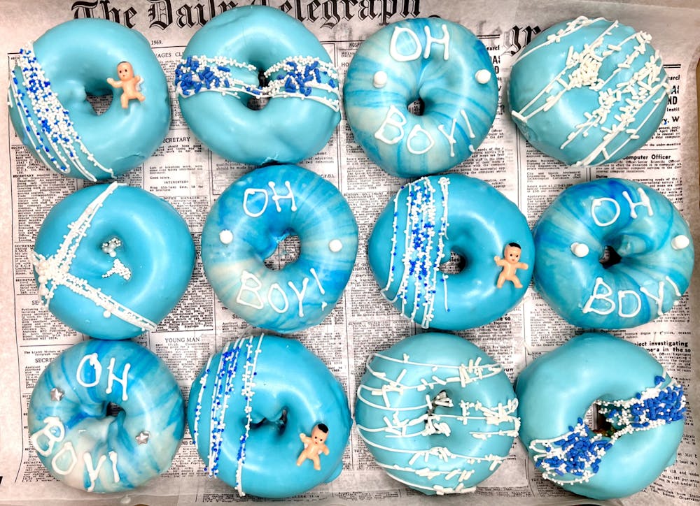 a group of different colored doughnut