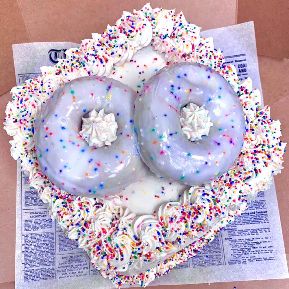 a variety of donuts sitting on top of a table
