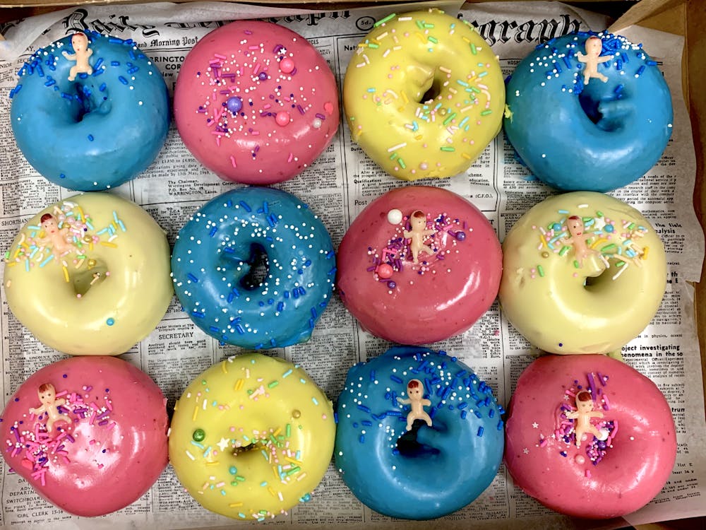 a group of different colored doughnut