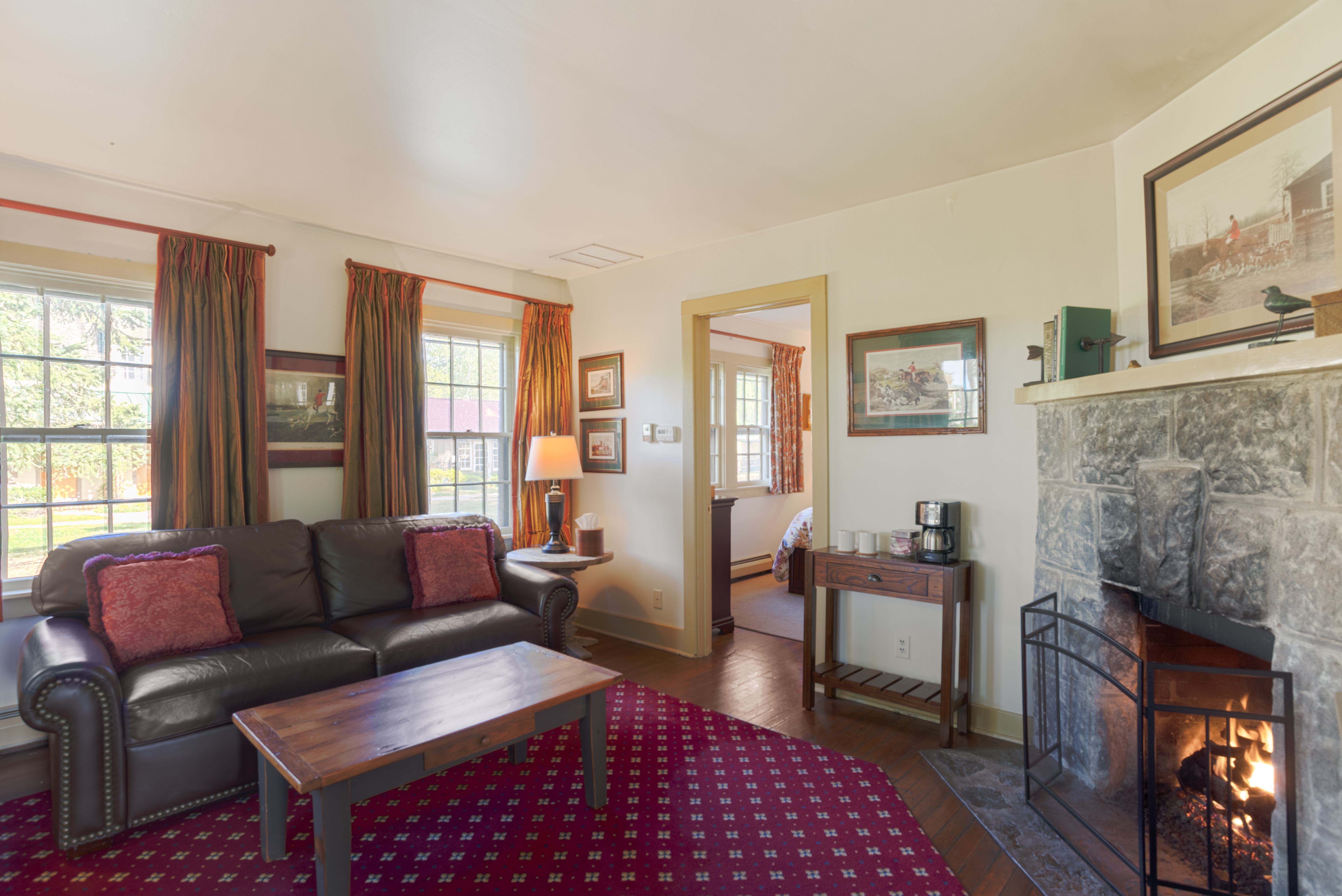 a living room with a fireplace and couch