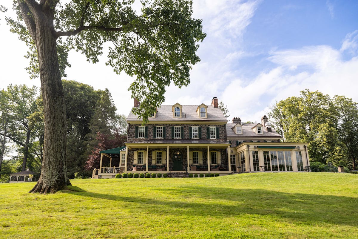 a large building with a grassy field