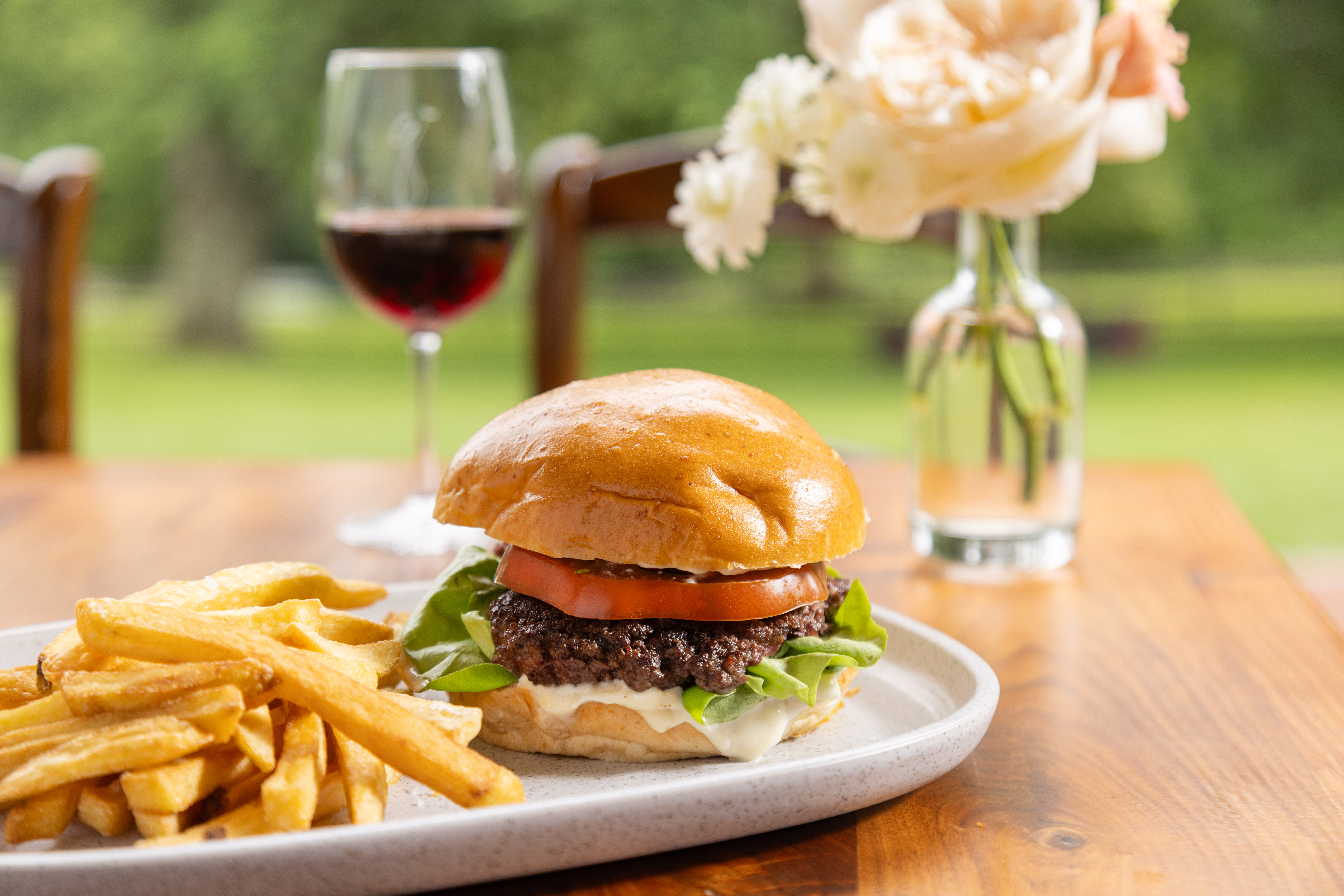 a close up of a sandwich and fries on a plate