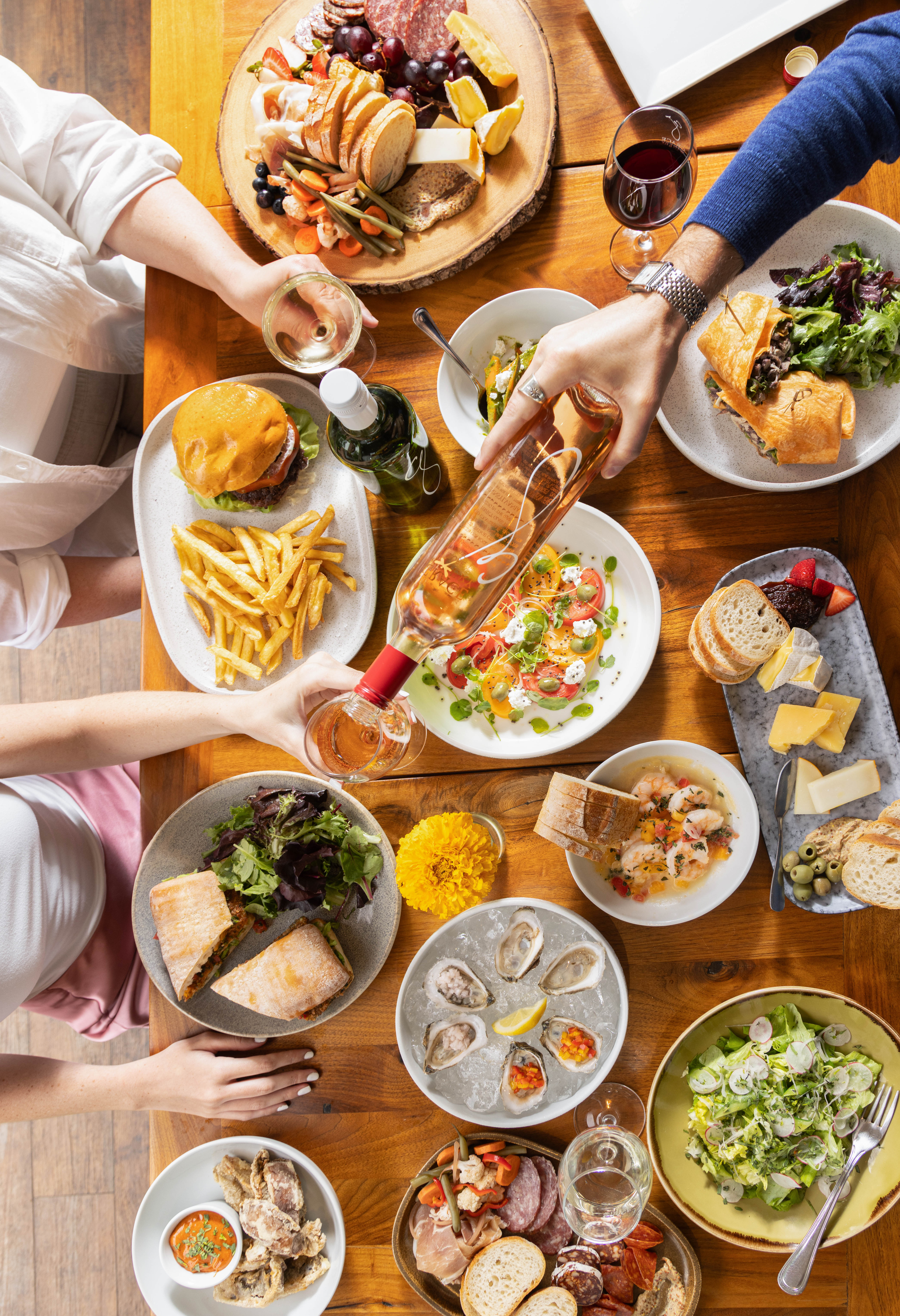 a group of people sitting at a table with a plate of food