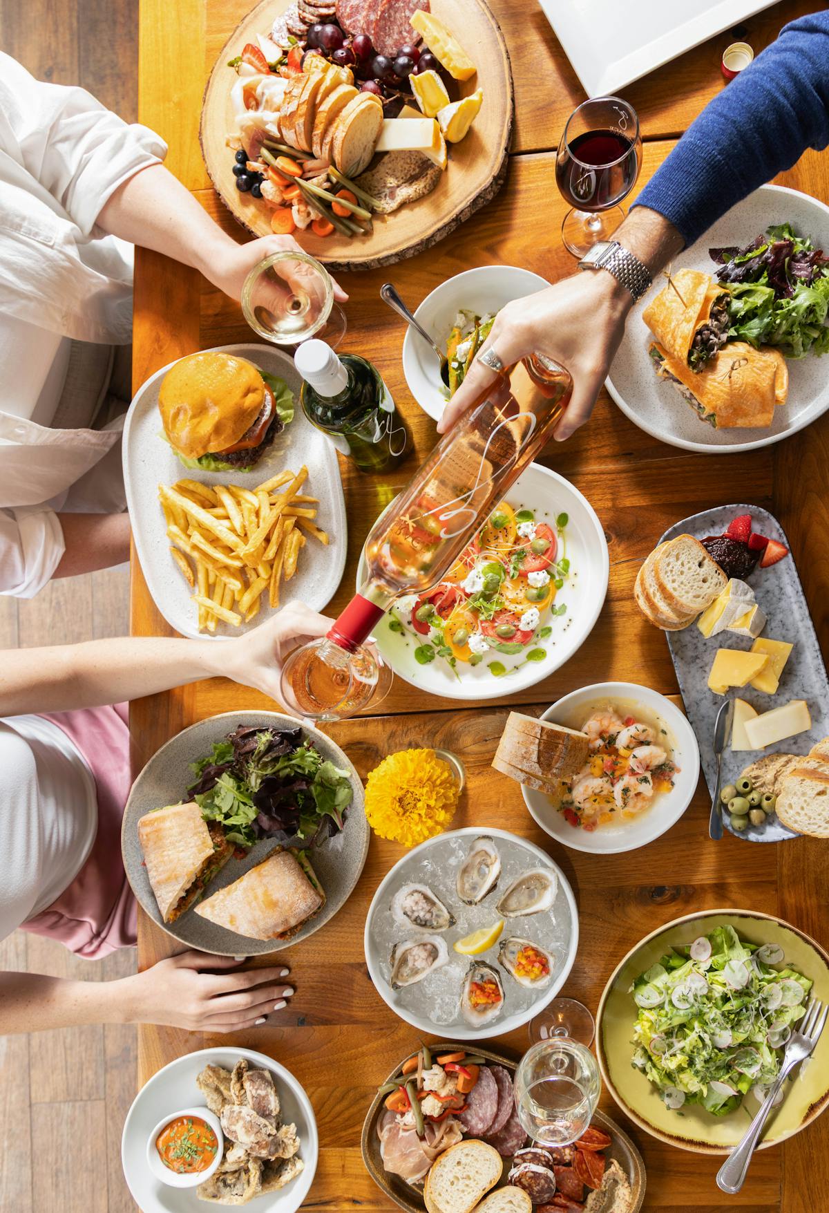 a group of people sitting at a table with a plate of food