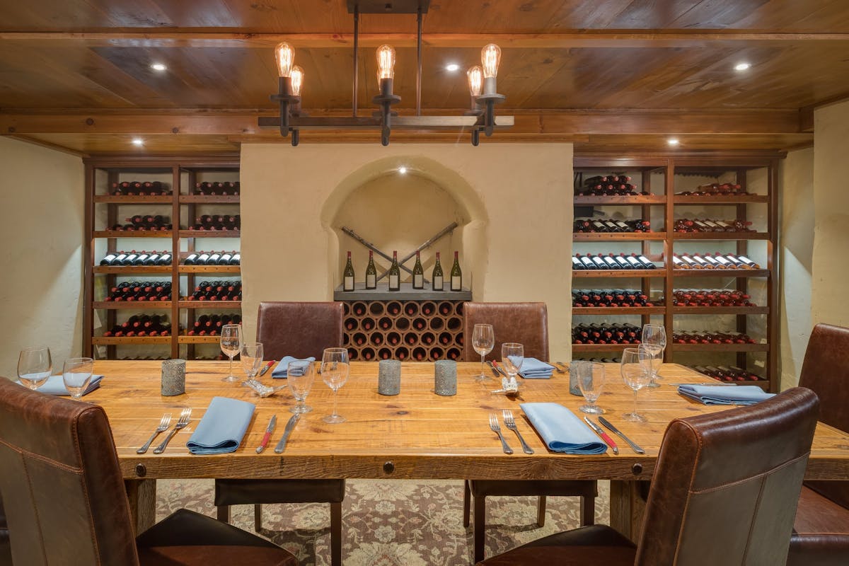 a kitchen with a dining table