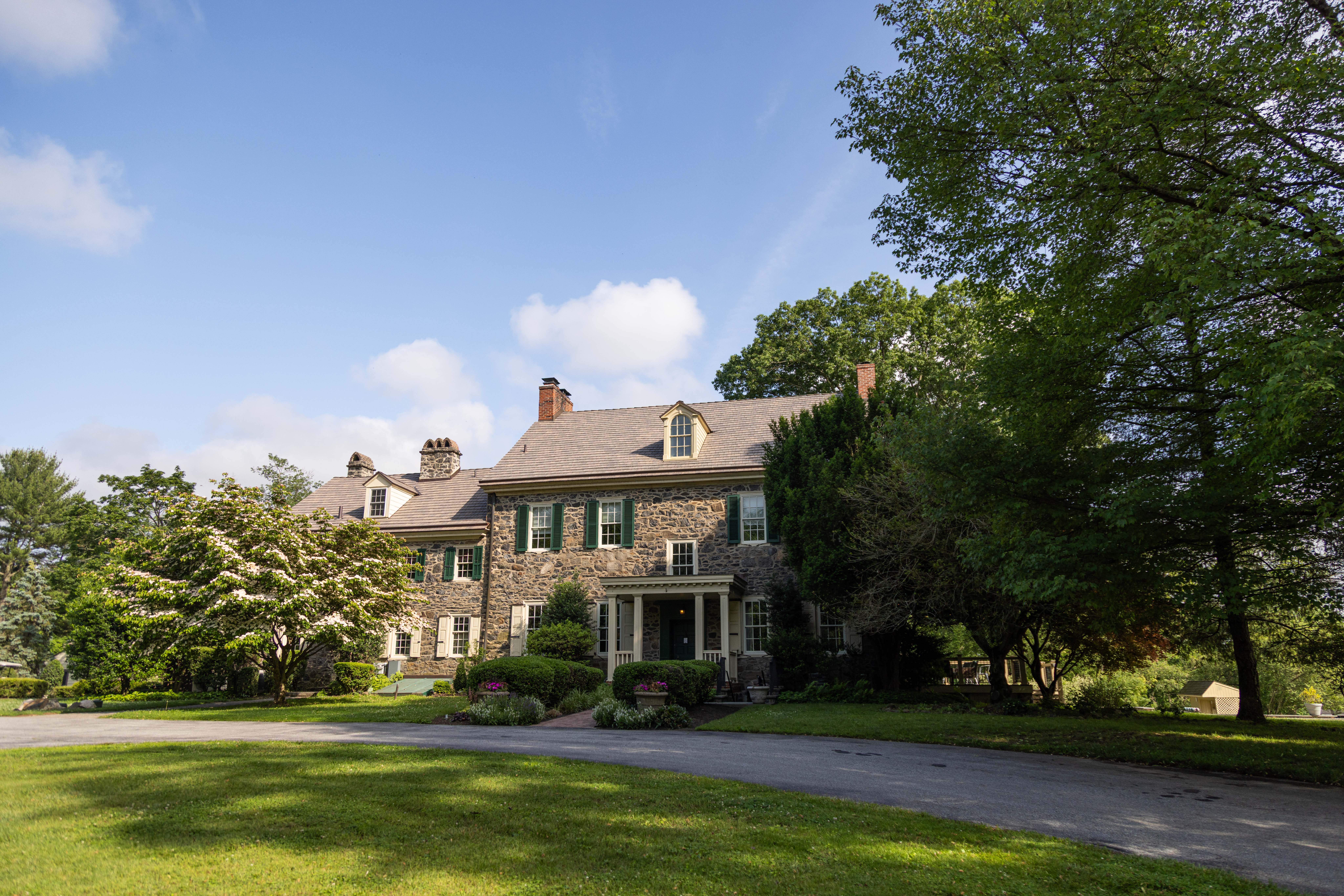 a tree in front of a house