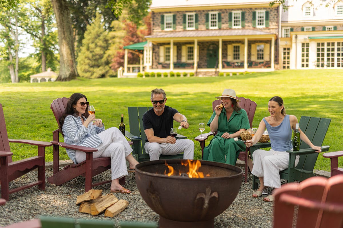 a group of people sitting at a picnic table