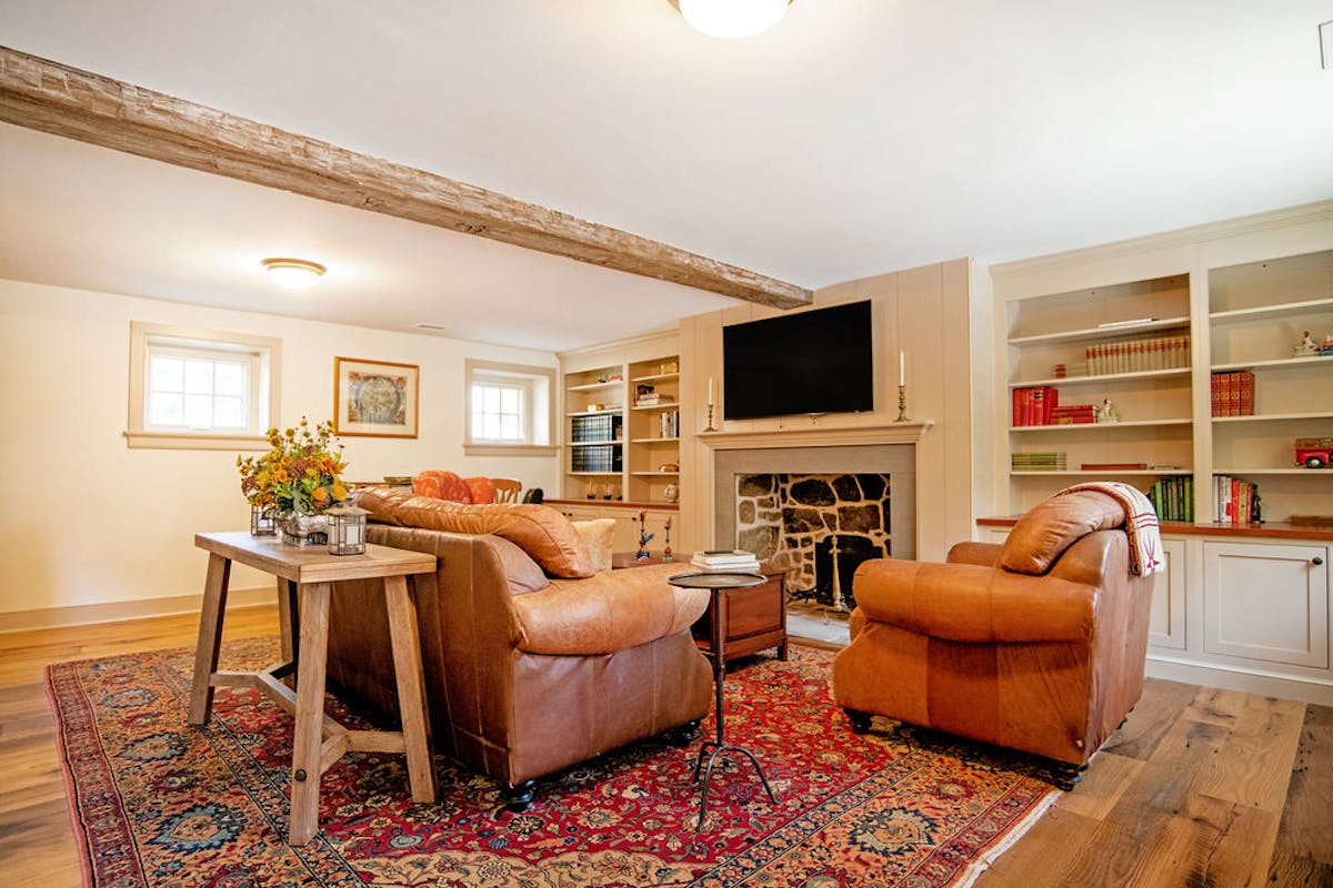 a living room filled with furniture and a fireplace