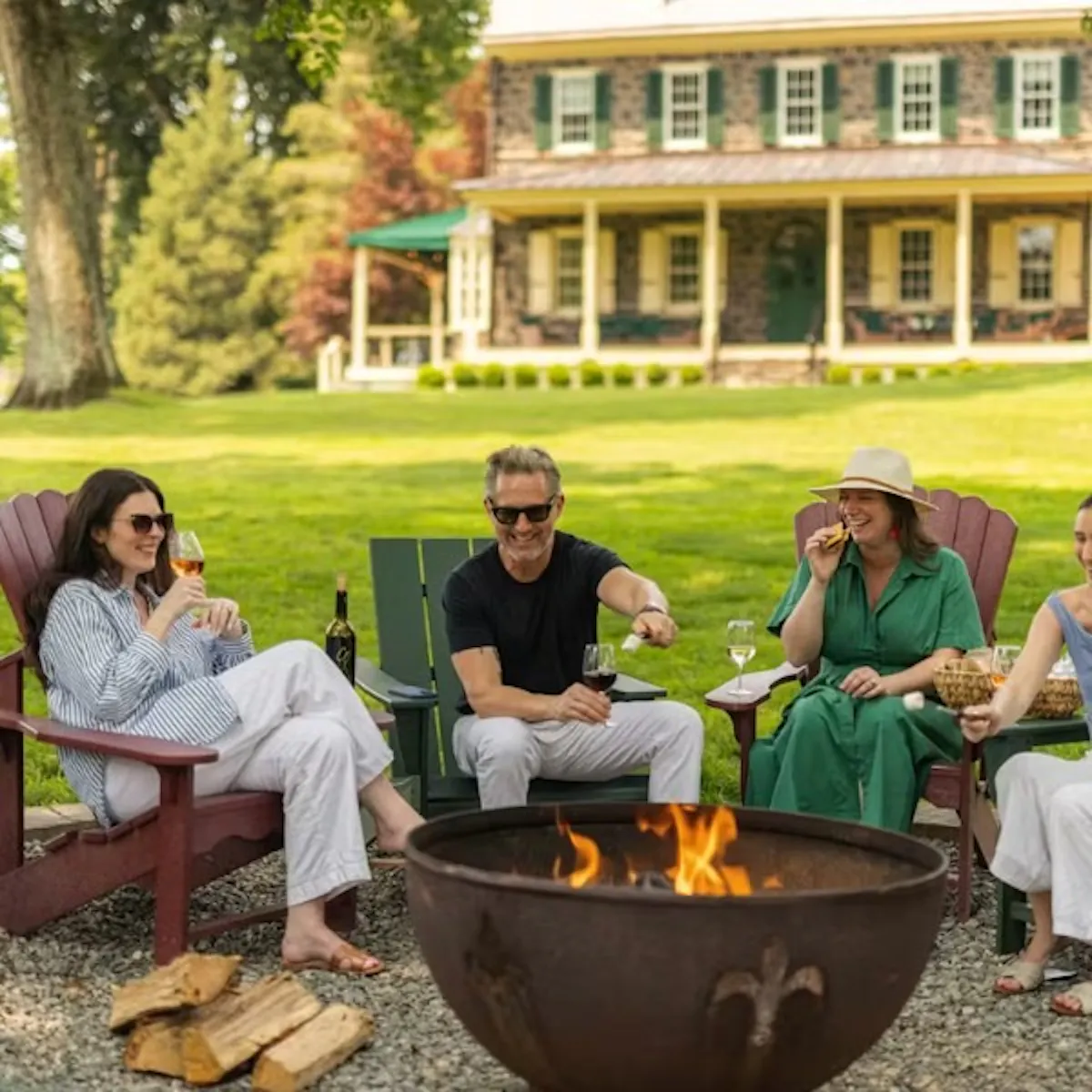 a group of people sitting at a picnic table