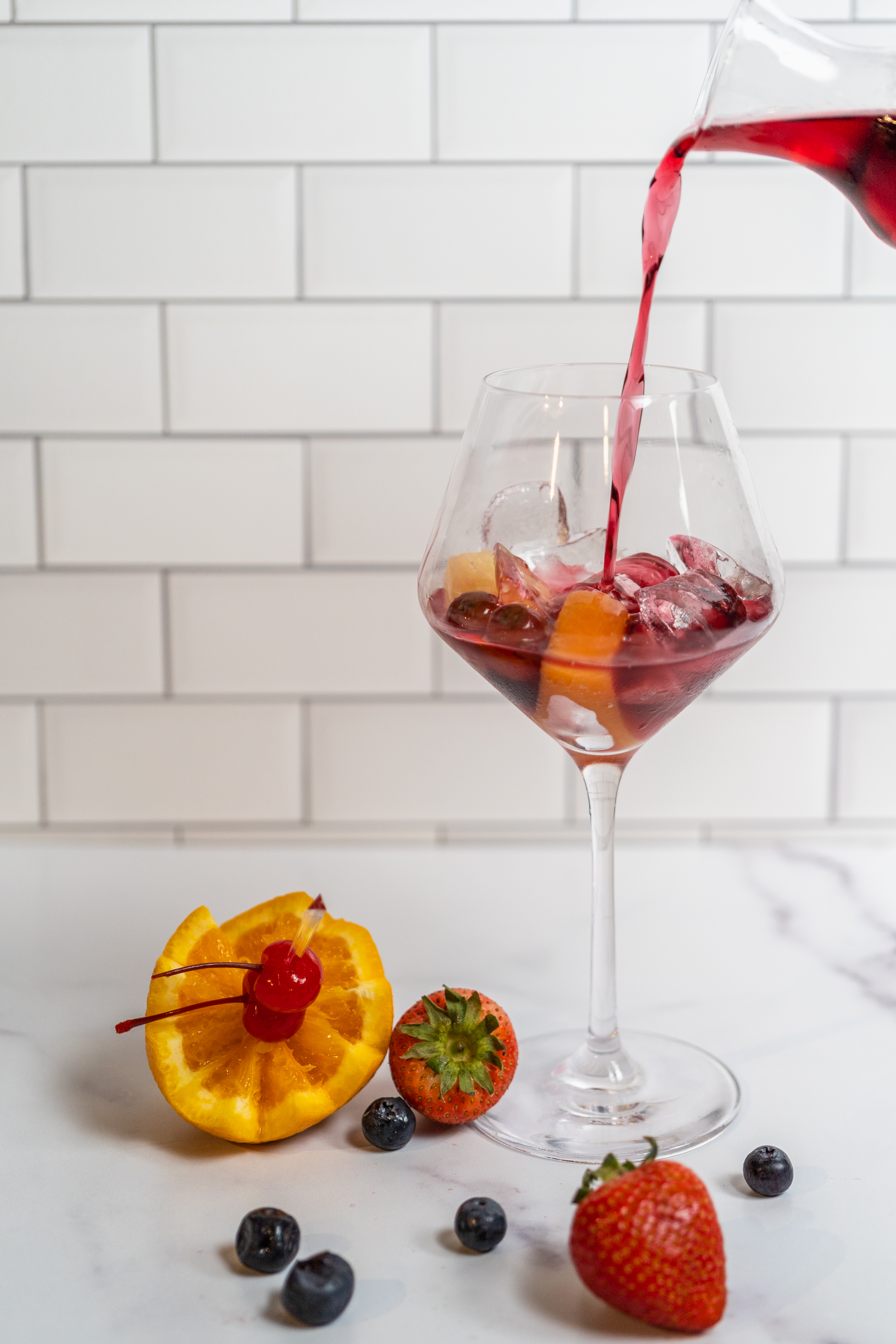 a plate of food and a glass of wine