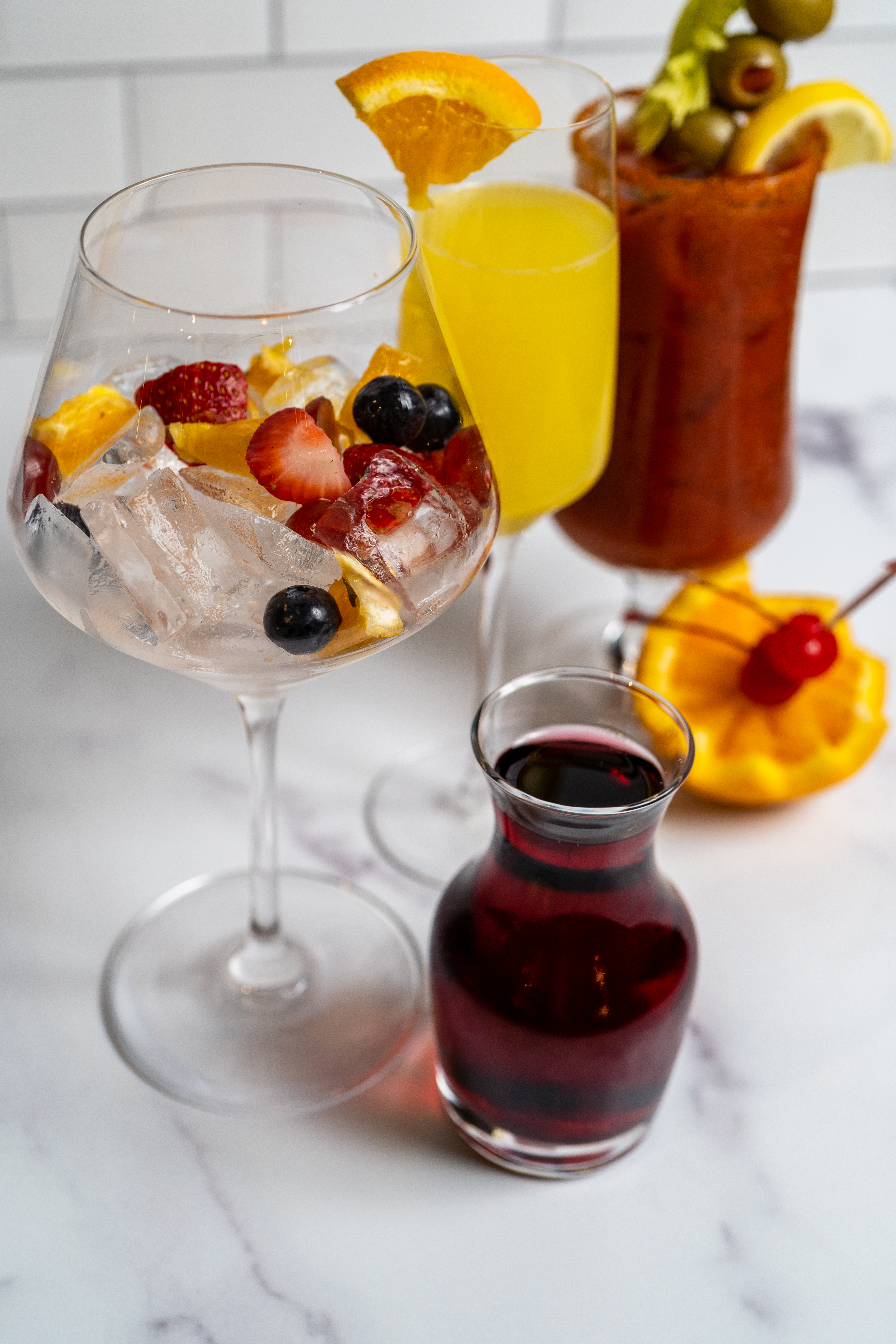 a table topped with glasses of wine