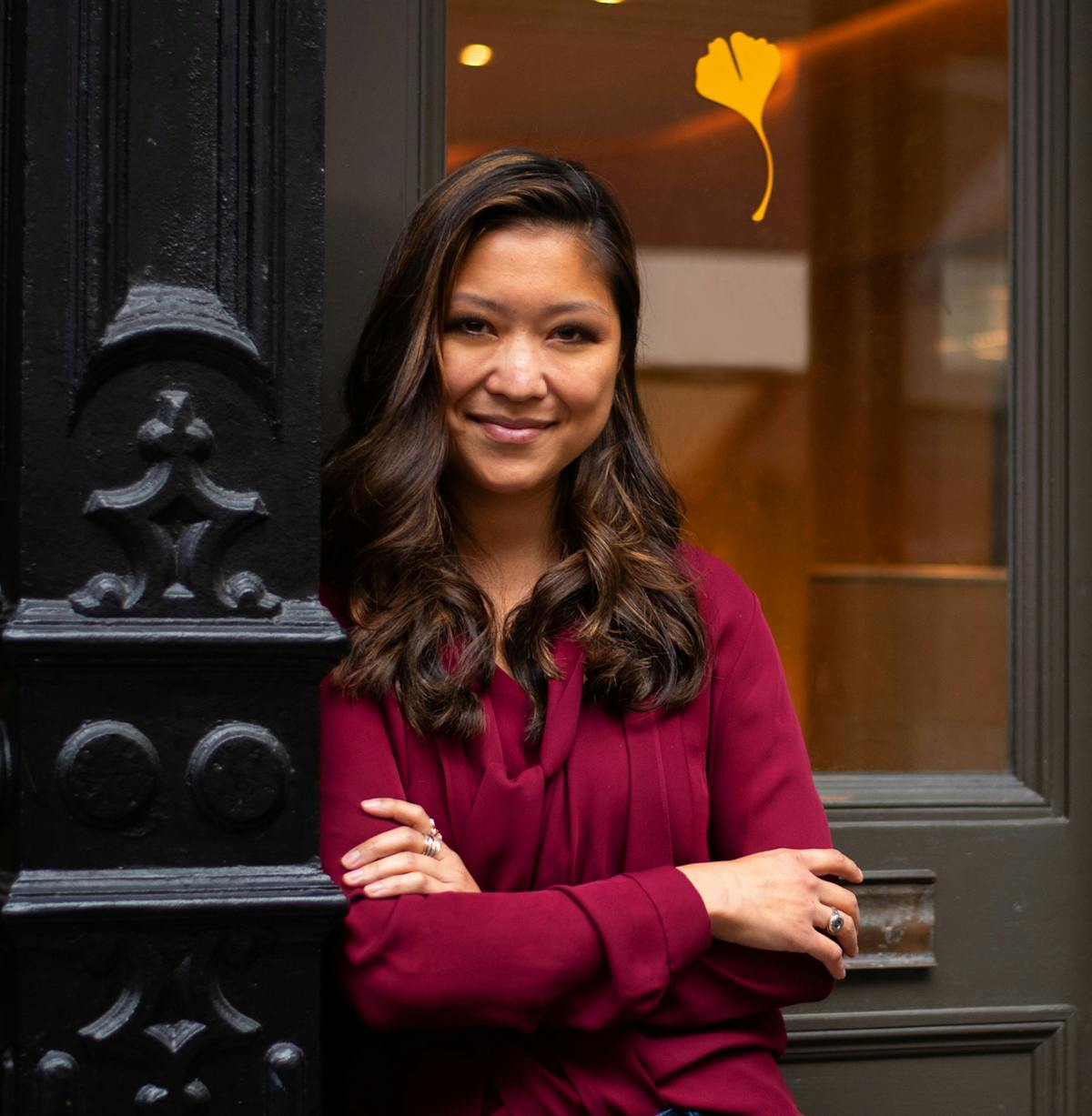 Emmeline Zhao standing in front of a window