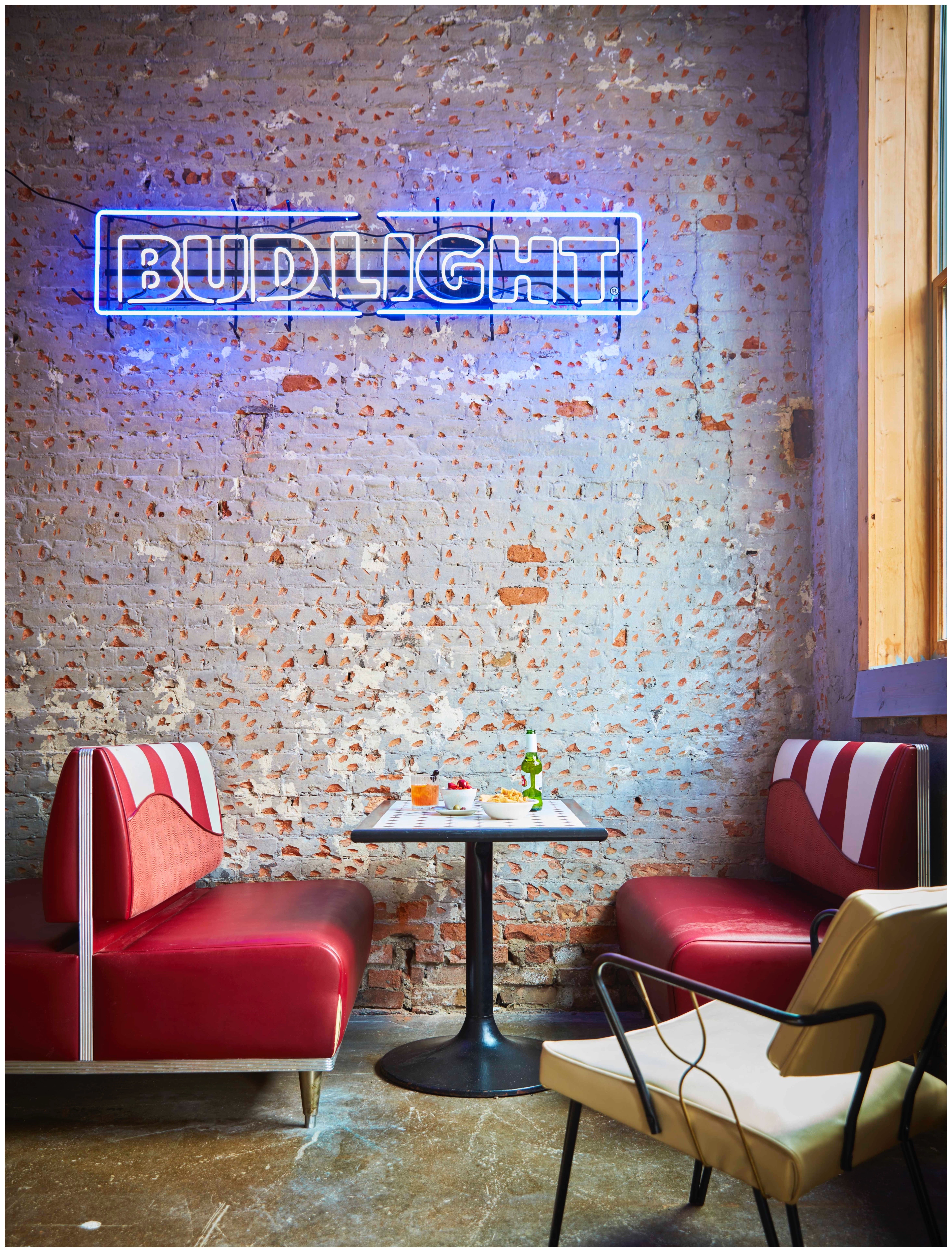 a chair sitting in front of a sign