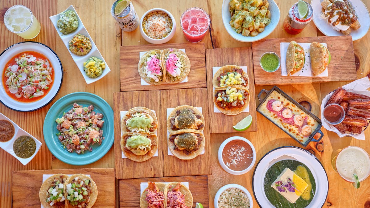 many different types of food on a wooden table