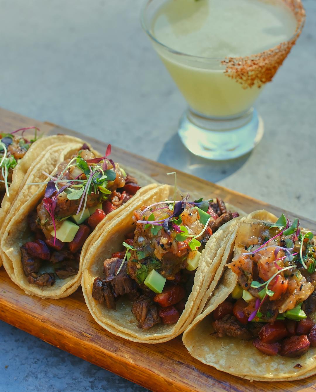 a close up of tacos on top of a table