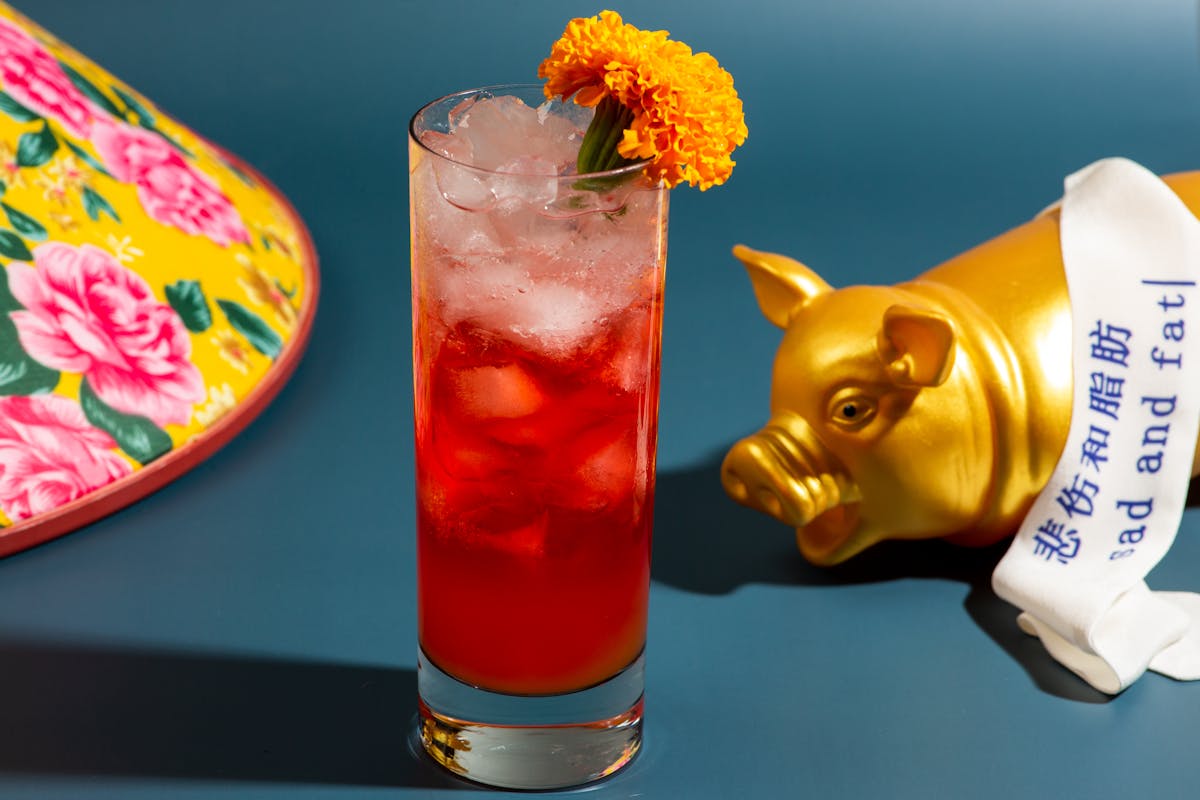 a drink with flowers on a table