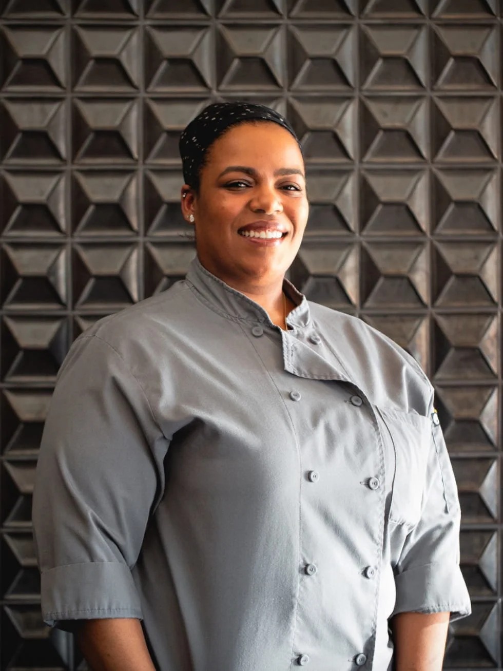 a woman wearing a chef's coat