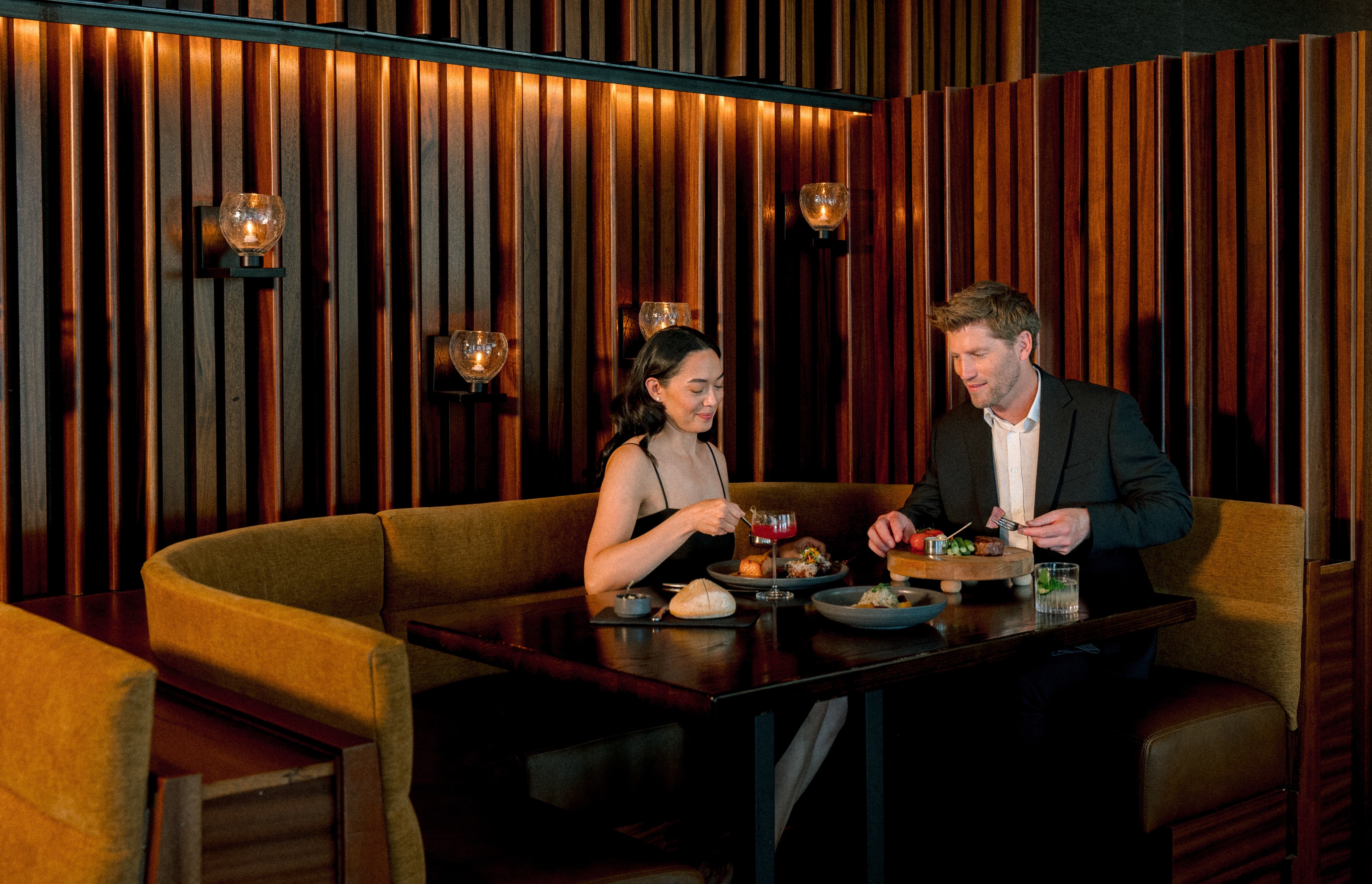 a man and woman eating at a table