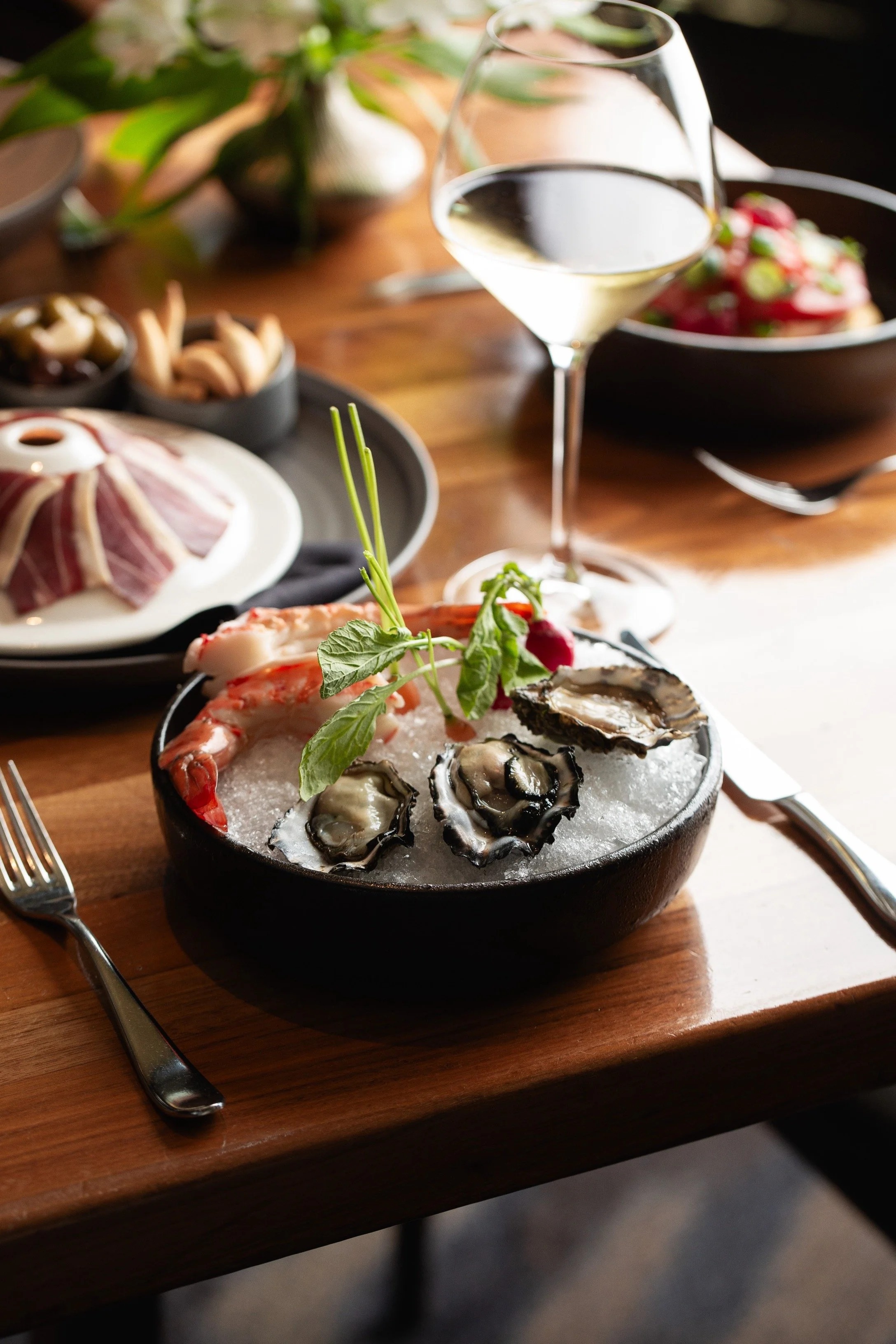 a bowl of seafood on a table
