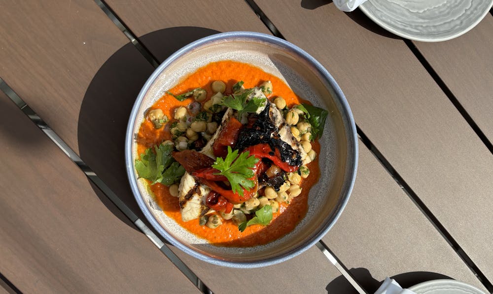 a bowl of food sitting on a table