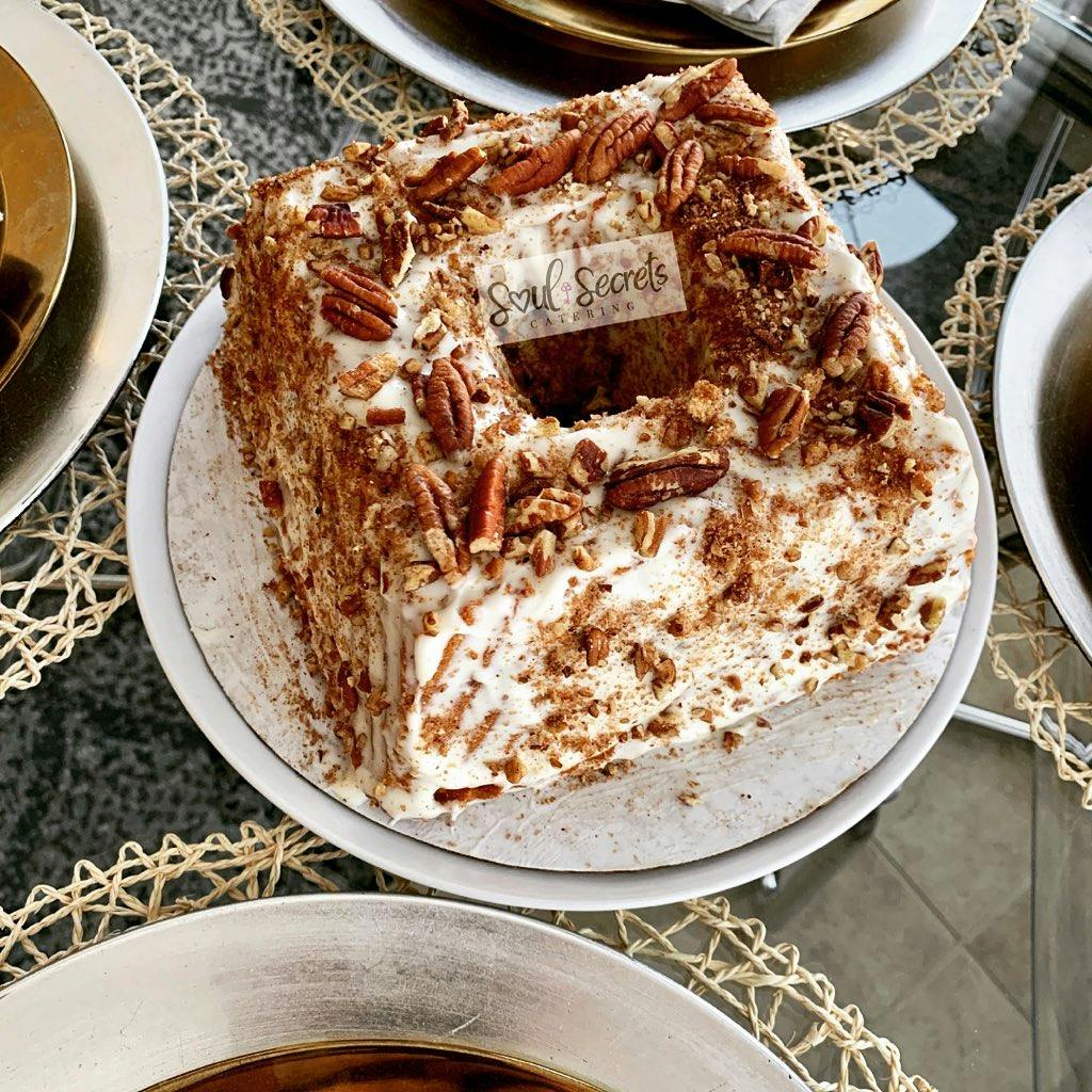 a bowl of food with a slice of cake on a plate