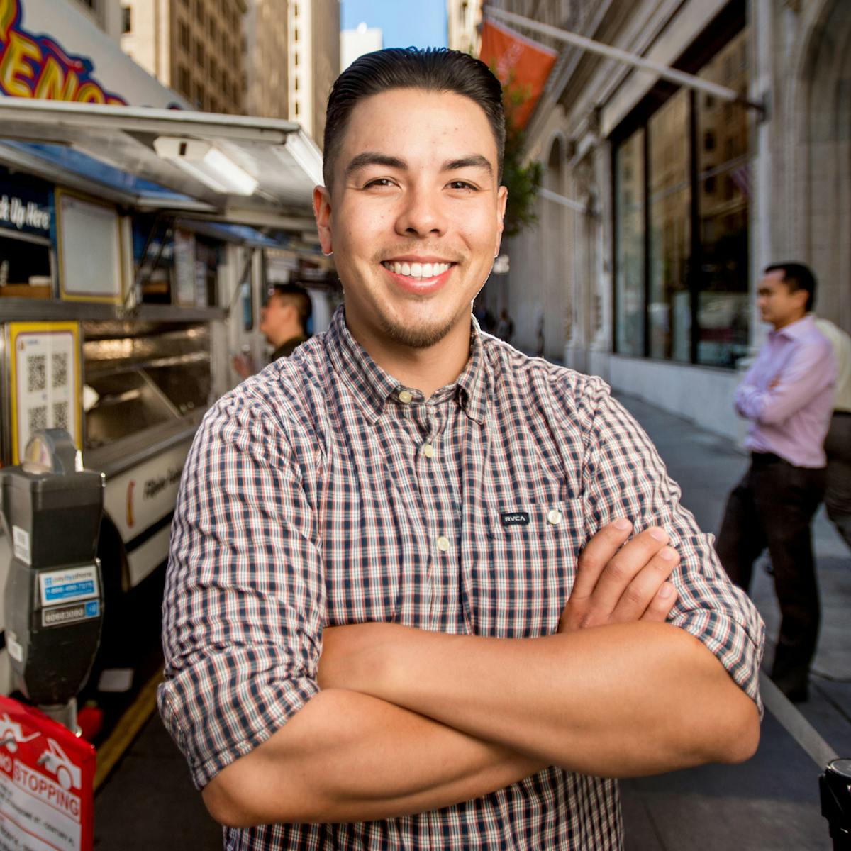 a man sitting in front of a building