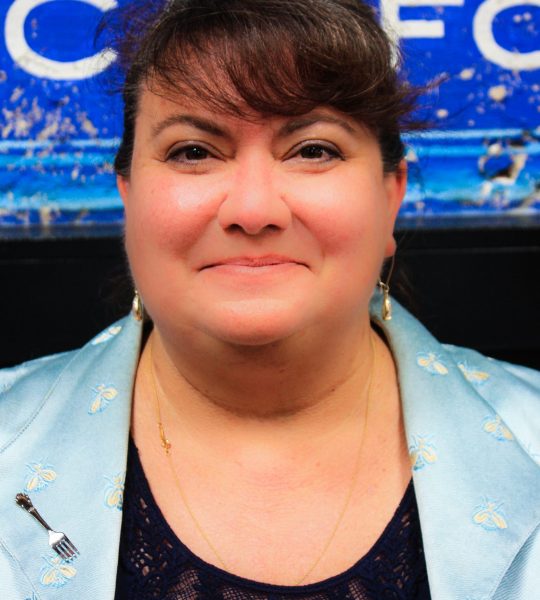 a woman smiling at camera