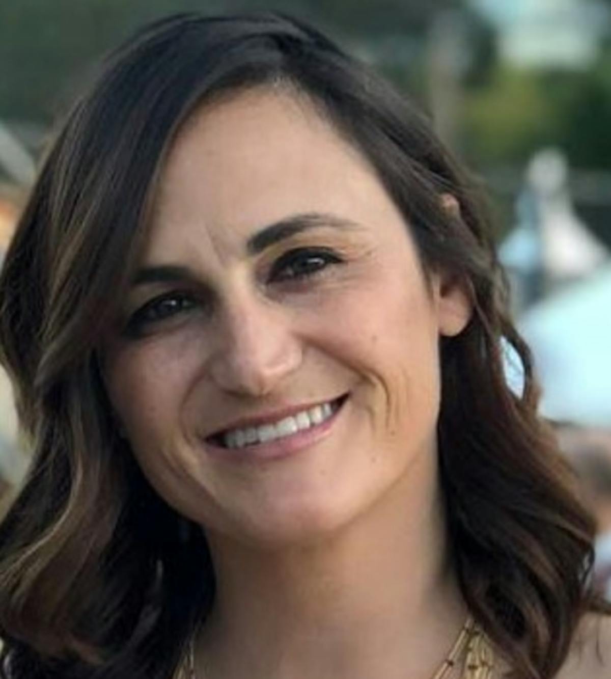 a woman smiling for the camera