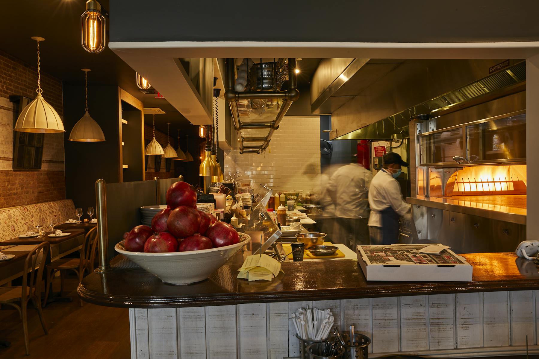 a kitchen with a table in a restaurant