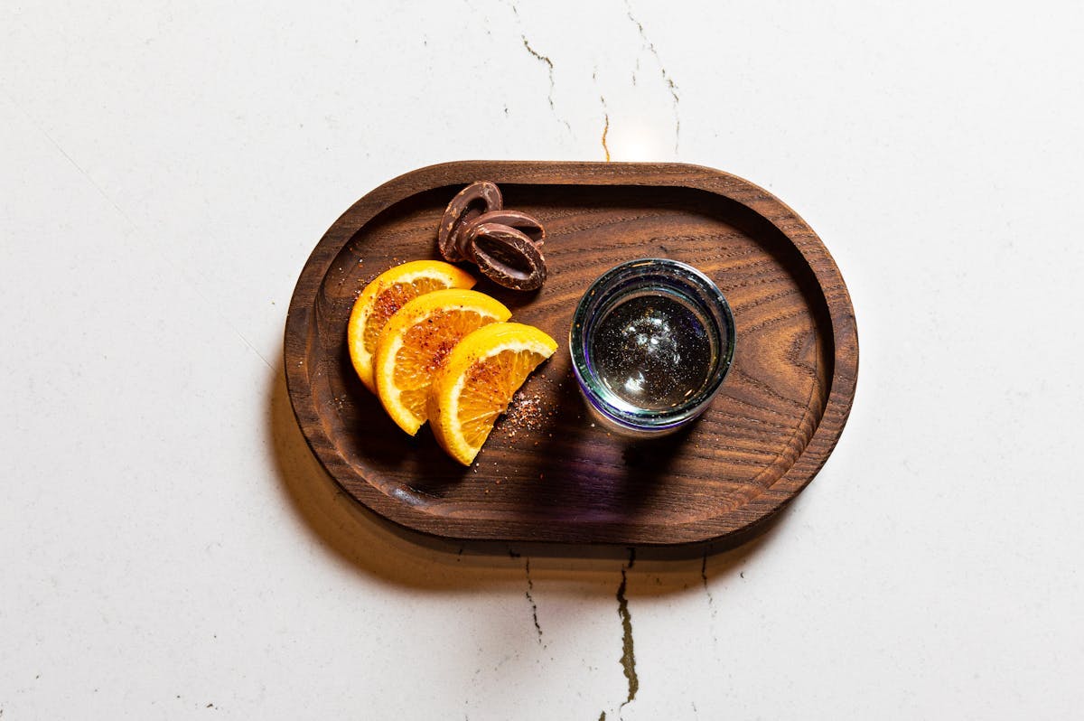 A plate with lemon and drink